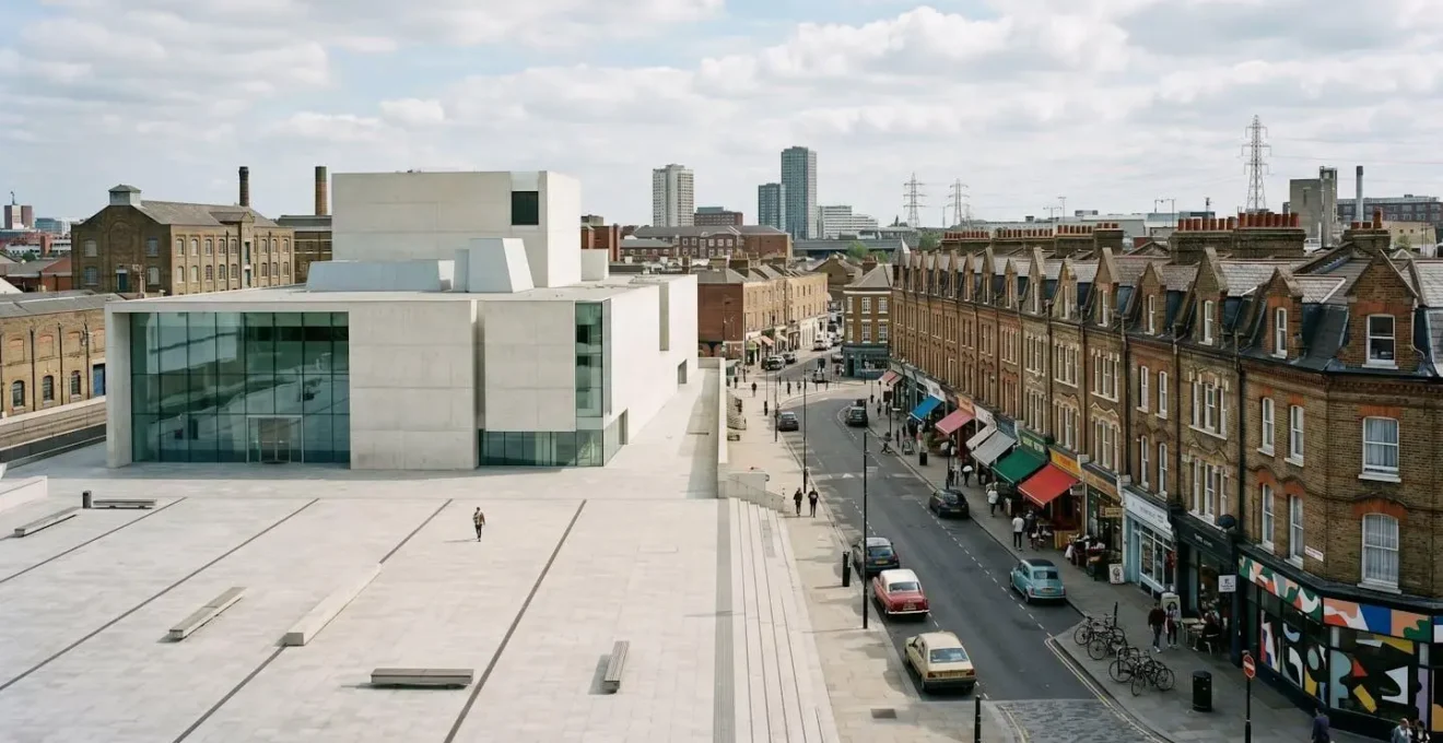 Contrast between empty modern arts building and thriving traditional businesses