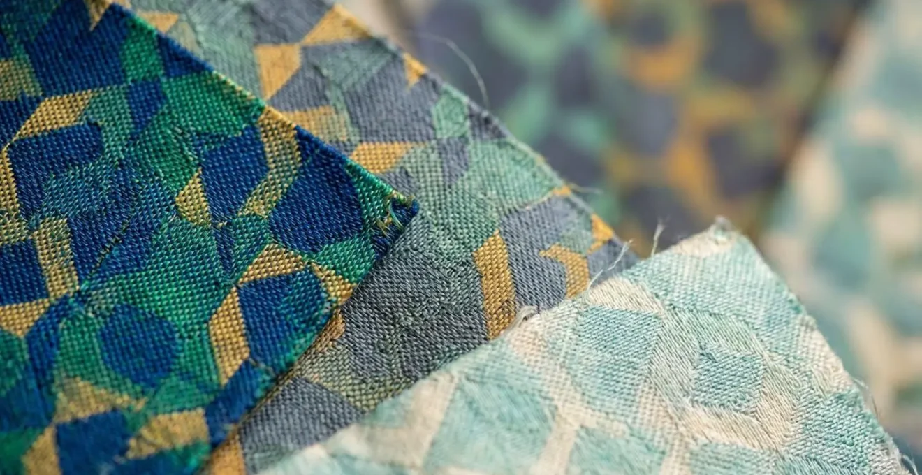 Macro shot of printed silk fabric showing color variation and ink absorption patterns